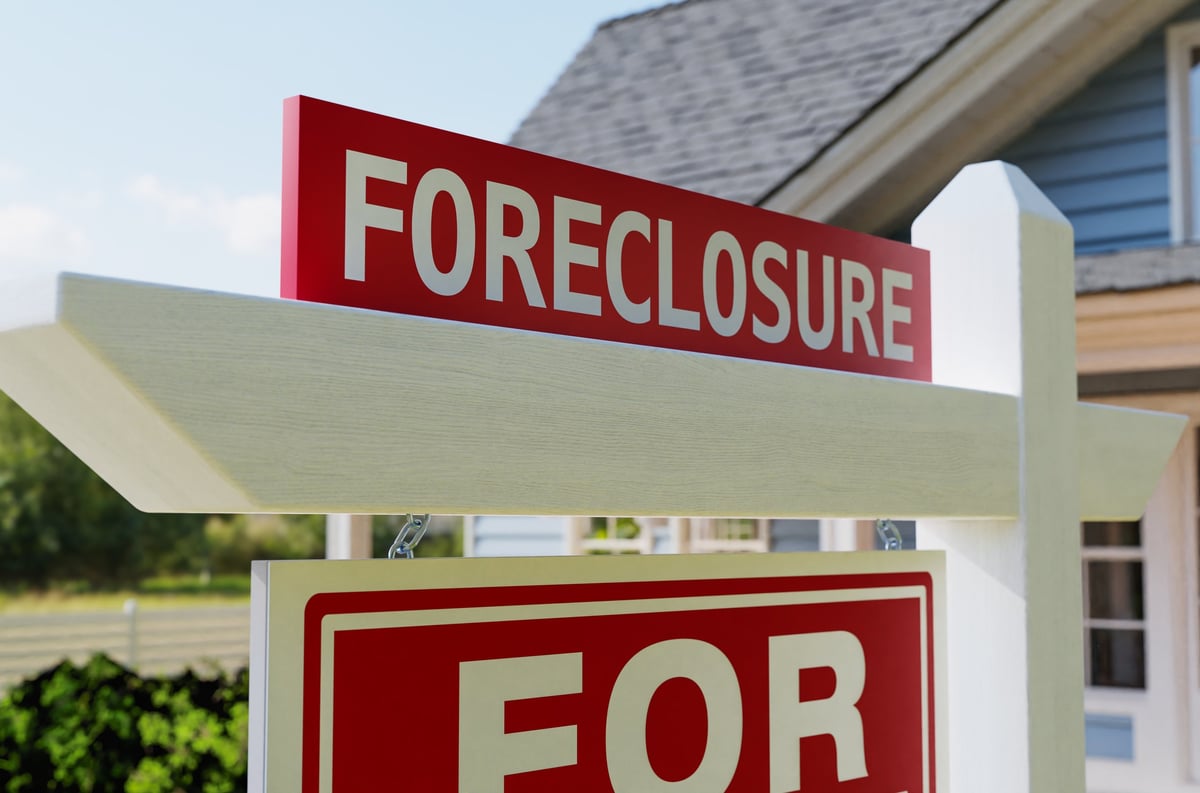 Foreclosure For Sale Real Estate Sign In Front of House