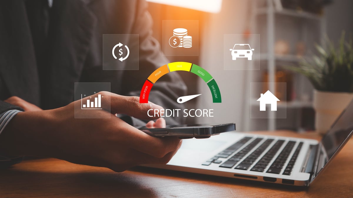 Businessman evaluating consumer statistical data with credit score icon on dashboard