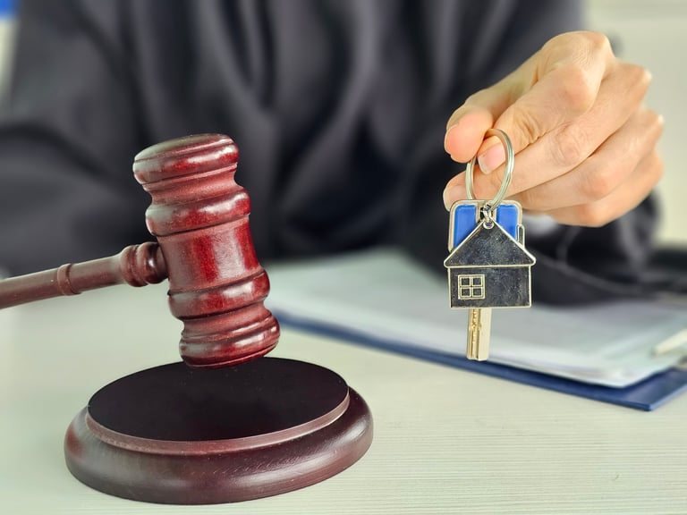 Judges wooden gavel and house keys. Selling real estate at auction concept