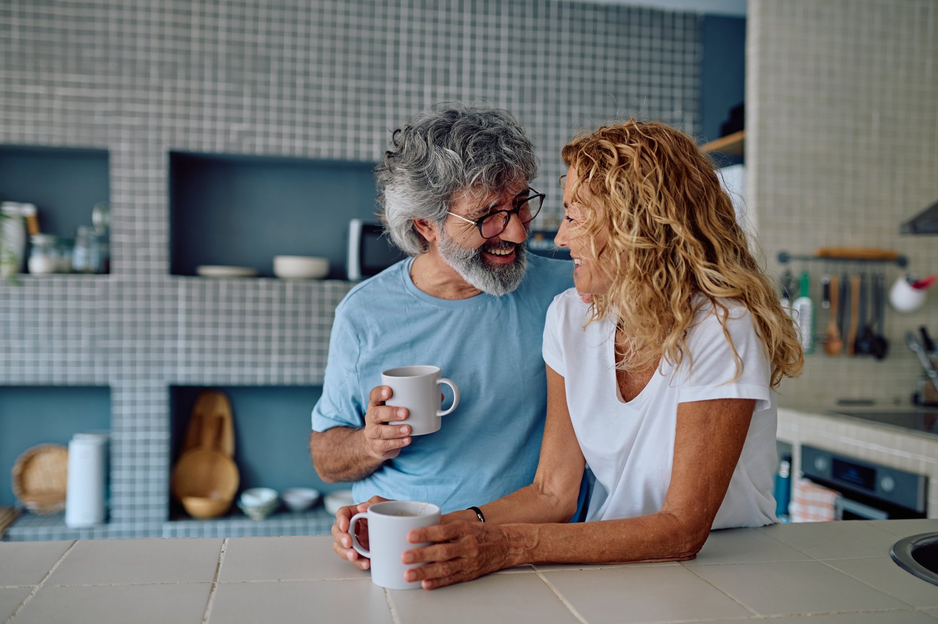 Smiling senior couple enjoying coffee together