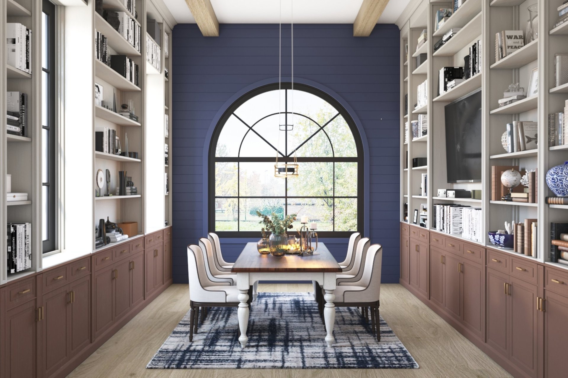 A contemporary dining room featuring a large arched window that allows natural light to flood in. The room is furnished with a long wooden dining table surrounded by white chairs, and built-in bookshelves filled with books and decorative items on either side.